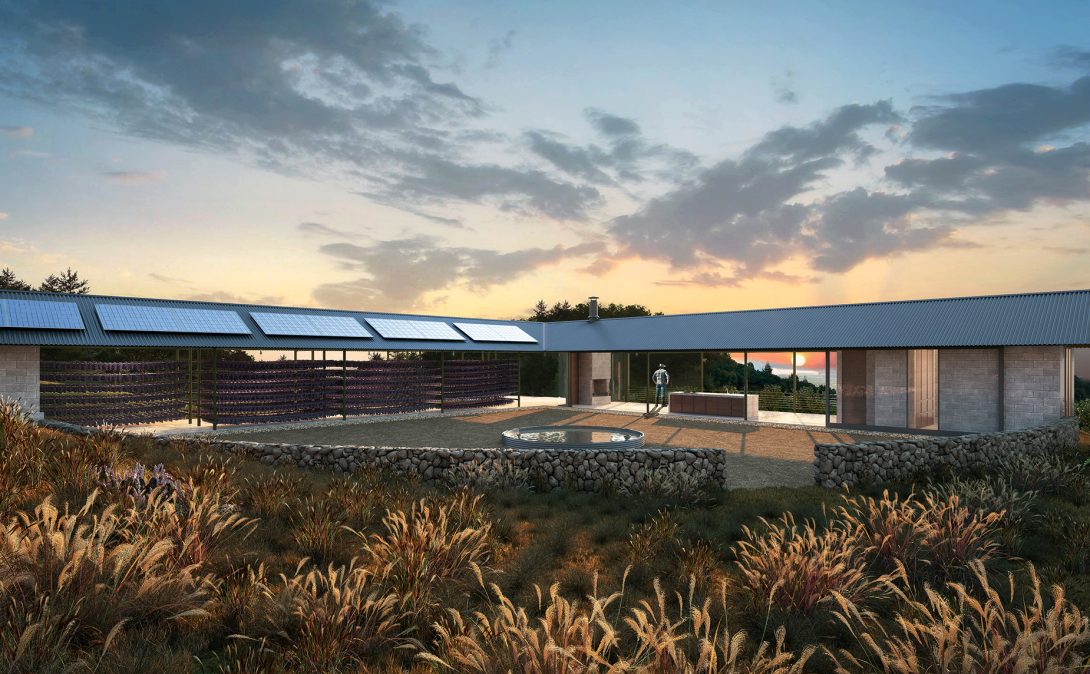 Courtyard at sunset with a round plunge pool and dry-stone retaining walls, framed by a solar-roofed shelter and a glass-walled living wing