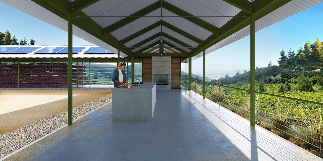 Open-air kitchen with concrete island under a pitched steel frame, overlooking a valley, with a solar-paneled grape-drying shelter alongside