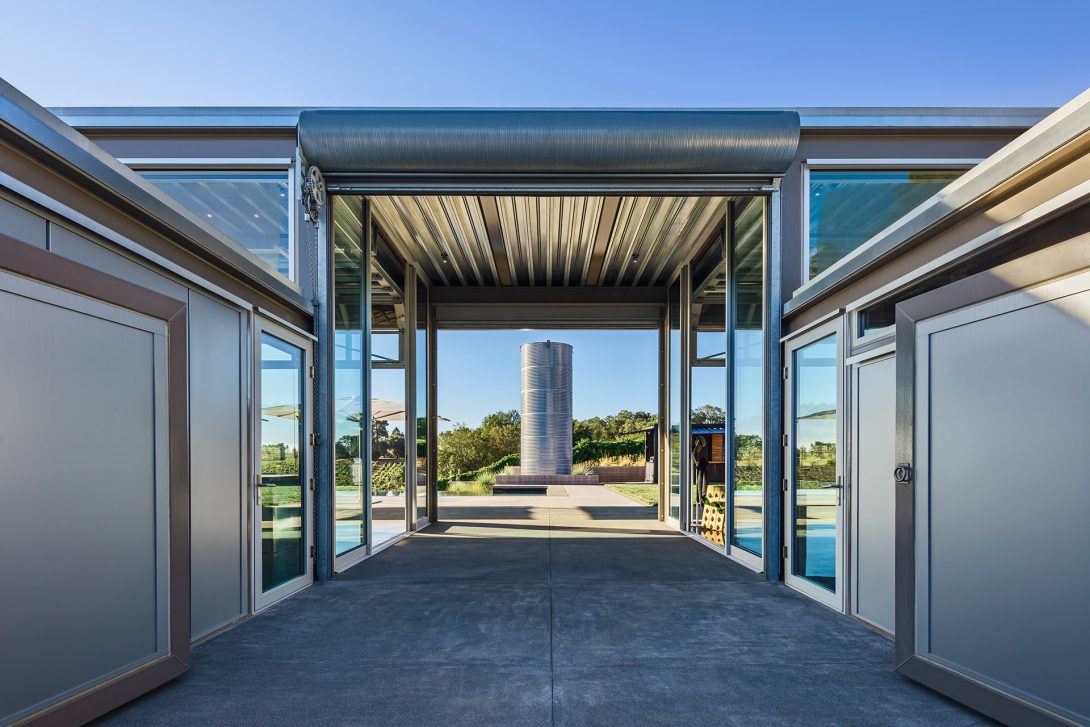 Breezeway entry framing the steel water tower, Healdburg House.