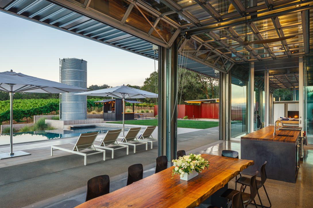 Interior view overlooking the pool terrace, vineyard café, and water tower, Healdsburg House